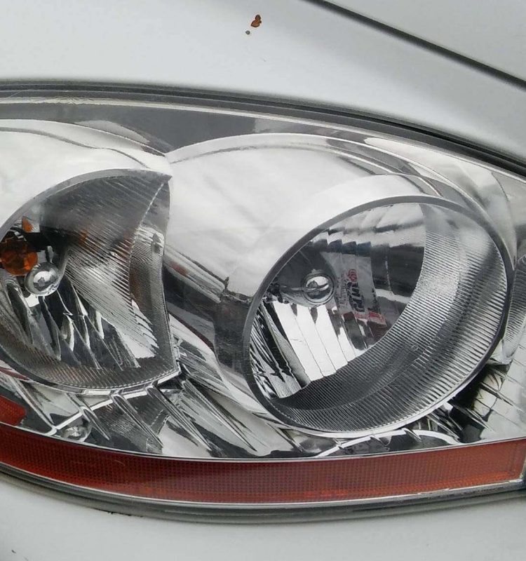 a after picture of a headlight restoration service